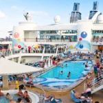 the crowd on the pool deck of a cruise ship.