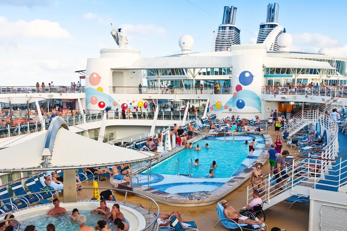 the crowd on the pool deck of a cruise ship.